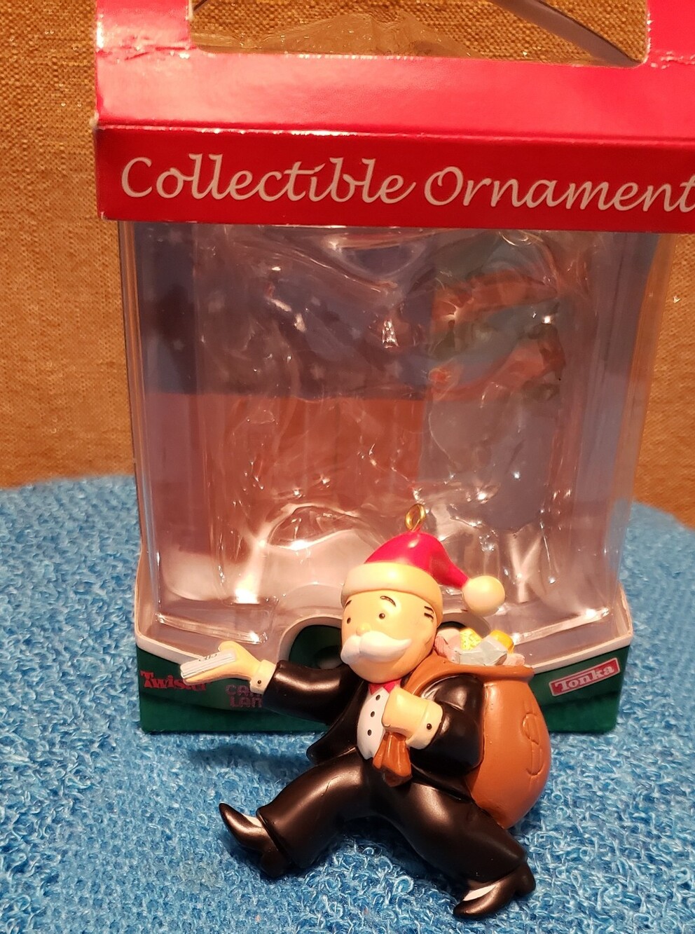 Santa Ornament in Black Suit with Red Hat and Brown Sack